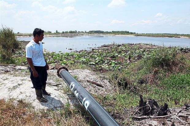 Water for peat swamp: The Forestry Department intends to tap water from this pond nearest to the Raja Muda Forest Reserve to prevent the peat land from getting too dry to reduce the risk of fires during the hot season. A pump will be fitted to the pipe to draw water for peatland irrigation.